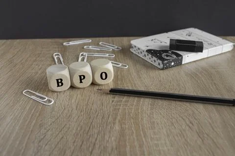 BPO acronym Business Process Outsourcing on wooden cubes. Stockfoto's