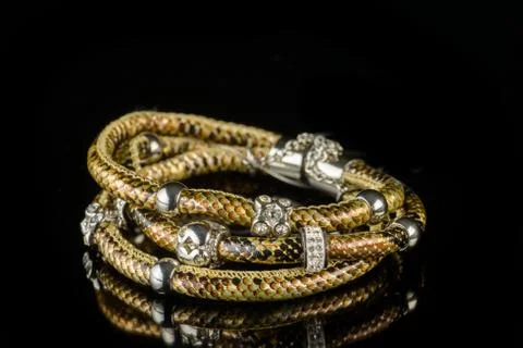 Bracelet on a black background Stock Photos
