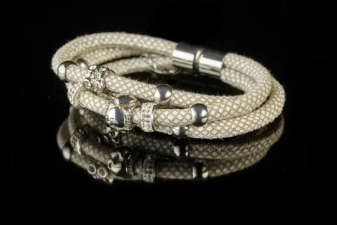 Bracelet on a black background Stock Photos