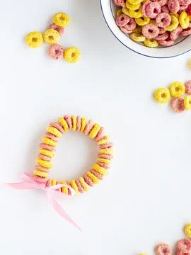 Bracelet made with froot ring shaped cereal for Mothers day Stock Photos