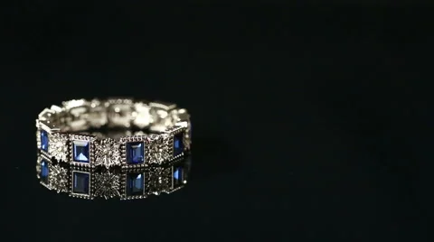 Bracelet with many stones on reflective background Stock Footage 62471387