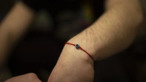 Bracelet with red thread. Magic Charm. Magic Amulet. Foto stock