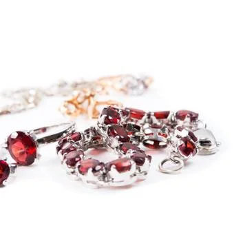 Bracelet with the ruby stones on the white Stock Photos
