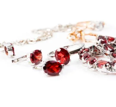 Bracelet with the ruby stones on the white Stock Photos