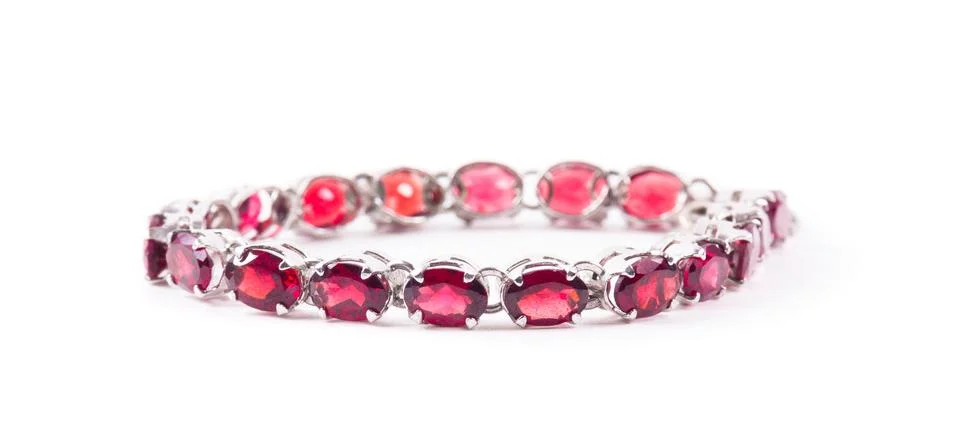 Bracelet with the ruby stones on the white Stock Photos
