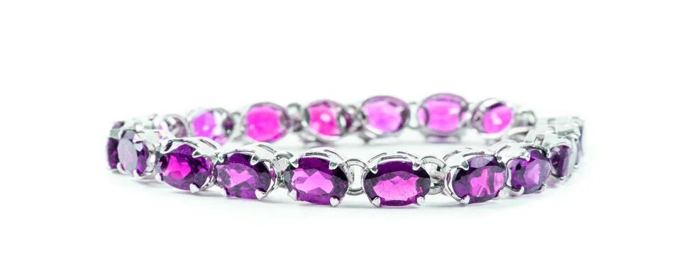 Bracelet with the ruby stones on the white Stock Photos