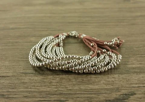 Bracelet on wooden background Stock Photos