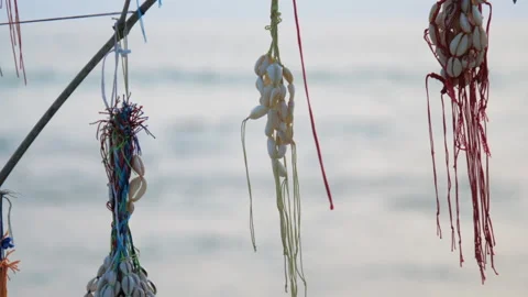 Bracelets with colorful threads and shells on wooden bar Vídeos de archivo 145111672