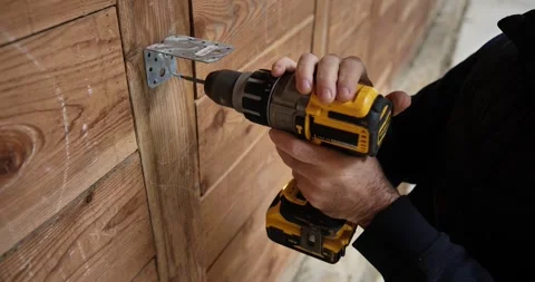 Bracket Install: Precision in Construction Stock Footage 327757208