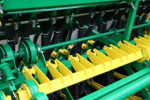 Brackets for fastening sections of a row seeder. Stock Photos