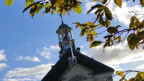 Brackley Town Hall Clock Tower Framed by Autumn Leaves, England, UK 動画素材 347521537