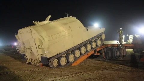 Bradley command post tracking onto trailer for transportation from Kuwait Video stock 102551489