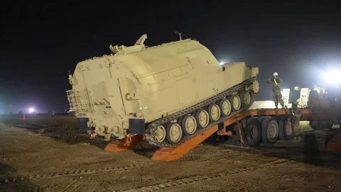 Bradley command post tracking onto trailer for transportation from Camp Buehring Video stock 102551513