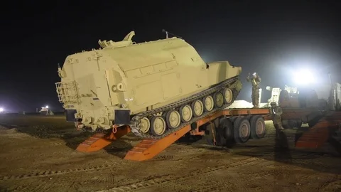 Bradley command post tracking onto trailer for transportation from Kuwait Video stock 102551522