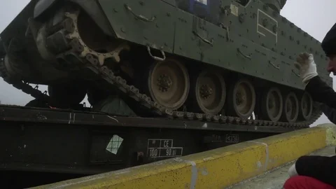 Bradley tank tracking onto low loader trailer Video stock 84254953