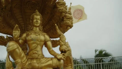 The Brahman Statue and the Developing Flag on the Back of the Big Buddha Statue Stock Footage 223820332