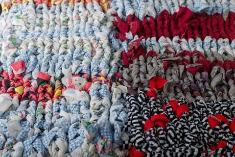 Braid knit pattern background, closeup. Knitting yarn made from multicolored Stock Photos