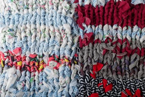 Braid knit pattern background, closeup. Knitting yarn made from multicolored Stock Photos