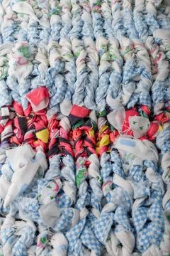 Braid knit pattern background, closeup. Knitting yarn made from multicolored Stock Photos