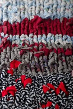 Braid knit pattern background, closeup. Knitting yarn made from multicolored Stock Photos