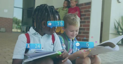 Braided boy, blond boy sitting school steps, flipping pages, sharing work, Stock Footage 331227269
