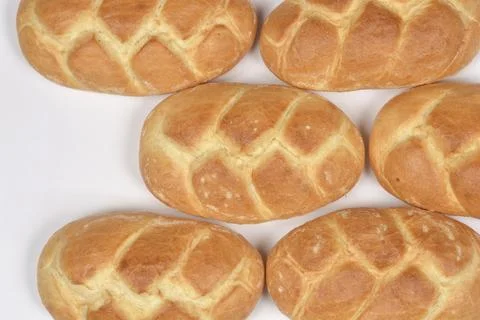 Braided Bread Rolls Pattern on White. Stock Photos