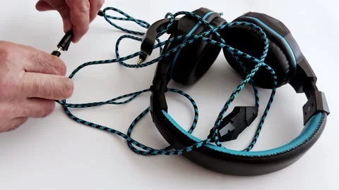 Braided Cable Locks In: Over-Ear Immersion Begins Stock Footage 313184823
