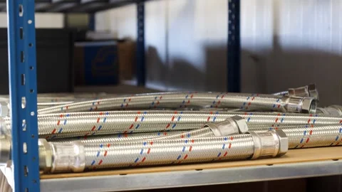 Braided Flexible Hoses on Warehouse Shelf Stock Footage 341919121