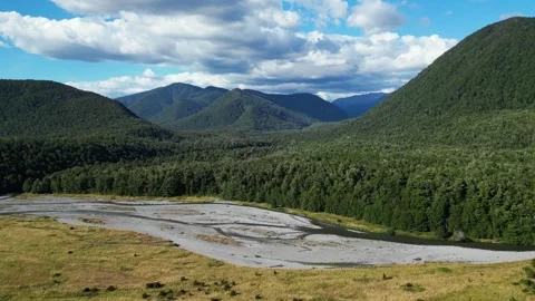 Braided river and lush hills in New Zealand Stock Footage 313972003