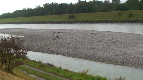 Braided river with lots of sediments on its riverbed, pan right Stock Footage 49769285