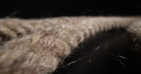 Braided rope extremely closeup on black background Stock Footage 244643666
