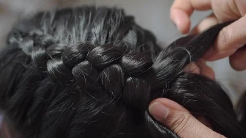 Braiding hair in a simple style Stock Footage 338217976