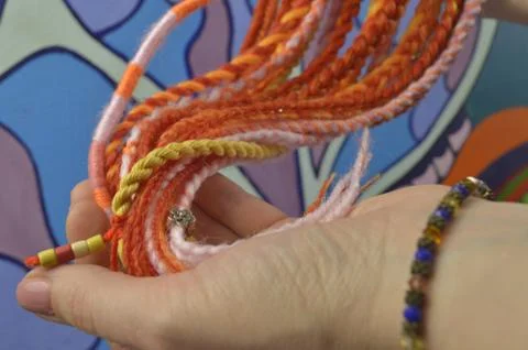 Braids on a color background at close range Stock Photos