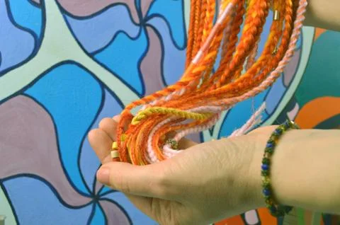 Braids on a color background at close range Stock Photos