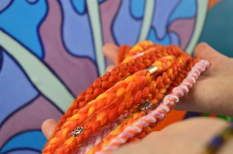 Braids on a color background at close range Stock Photos