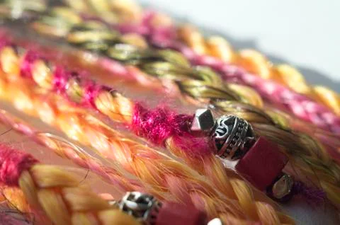 Braids on a wood background at close range Stock Photos