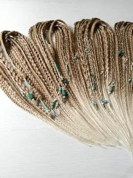 Braids on a wood background at close range Stock Photos