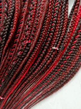 Braids on a wood background at close range Stock Photos