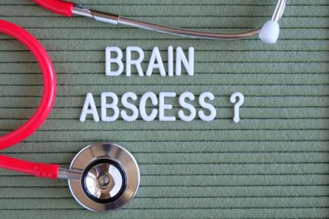 Brain abscess- text with a question mark on  green background with  stethosco Photos