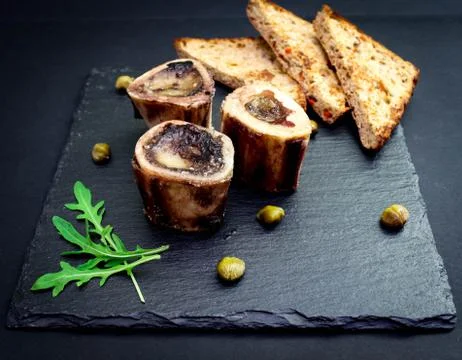 Brain beef bone on basalt plate top view Stock Photos
