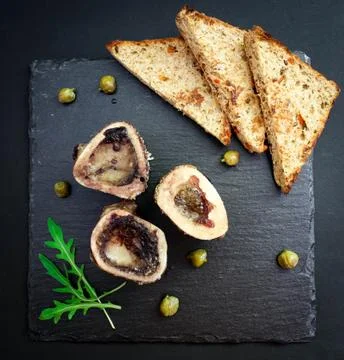 Brain beef bone on basalt plate top view Stock Photos