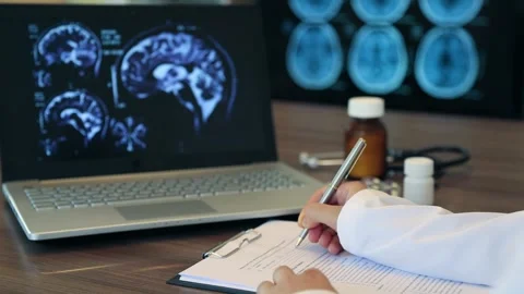 Brain Imaging Analysis with Medical Documentation Stock Footage 341125540