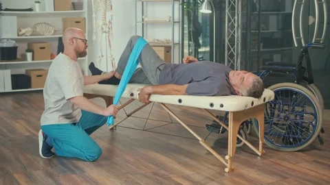 A Brain Stroke Patient Uses Physical Therapy to Restore and Increase Mobility. Stock Footage 163550481