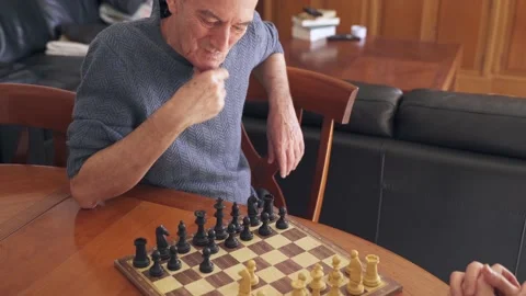 Brain training for senior citizens. Man playing chess with son on father's day Stock Footage 170695382
