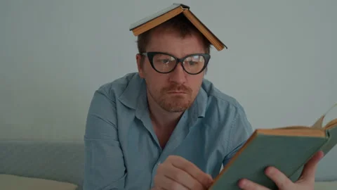 Brainiac man with book Stock Footage 240224691