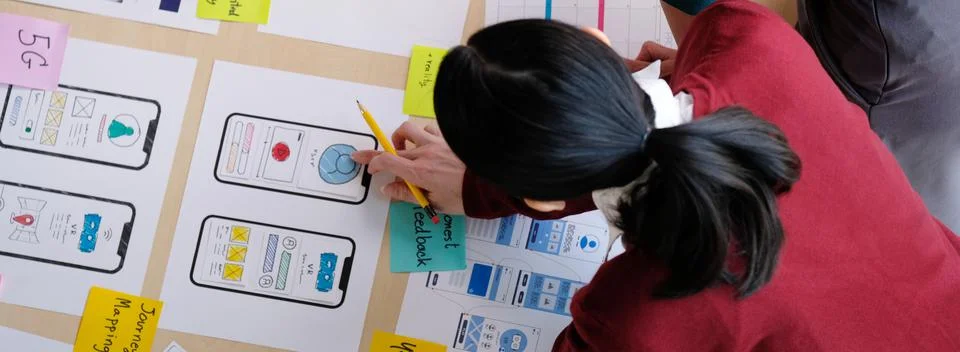 Brainstorm planing creative teamwork,  Mobile phone app developer team meetin Stock Photos