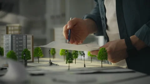 Brainstorm. The project architect reviews the planned building data in the p Stock Footage 270427505