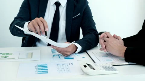 Brainstorming and Business Consulting, Marketer presents Graph data and plan Stock Footage 195082013