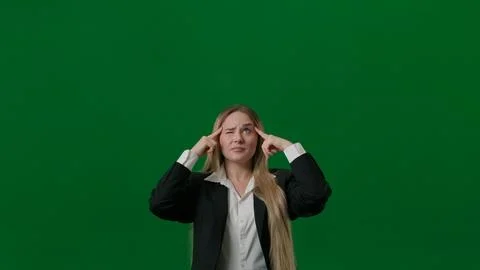 Brainstorming and problem solving concept. Female portrait on green screen. Girl Stock Photos
