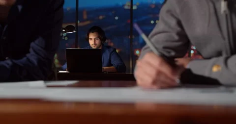 Brainstorming browsing online research, manager in the night office works with a Stock Footage 145294987